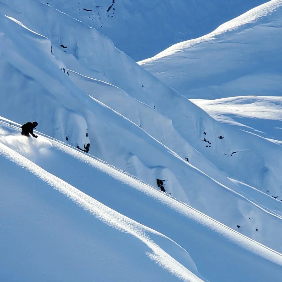 Glaciated peaks and ski lines in the Tordrillo Mountains of Alaska
